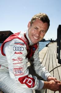 Tom Kristensen i den officielle Audi køredragt med CHGP logo på ærmet.